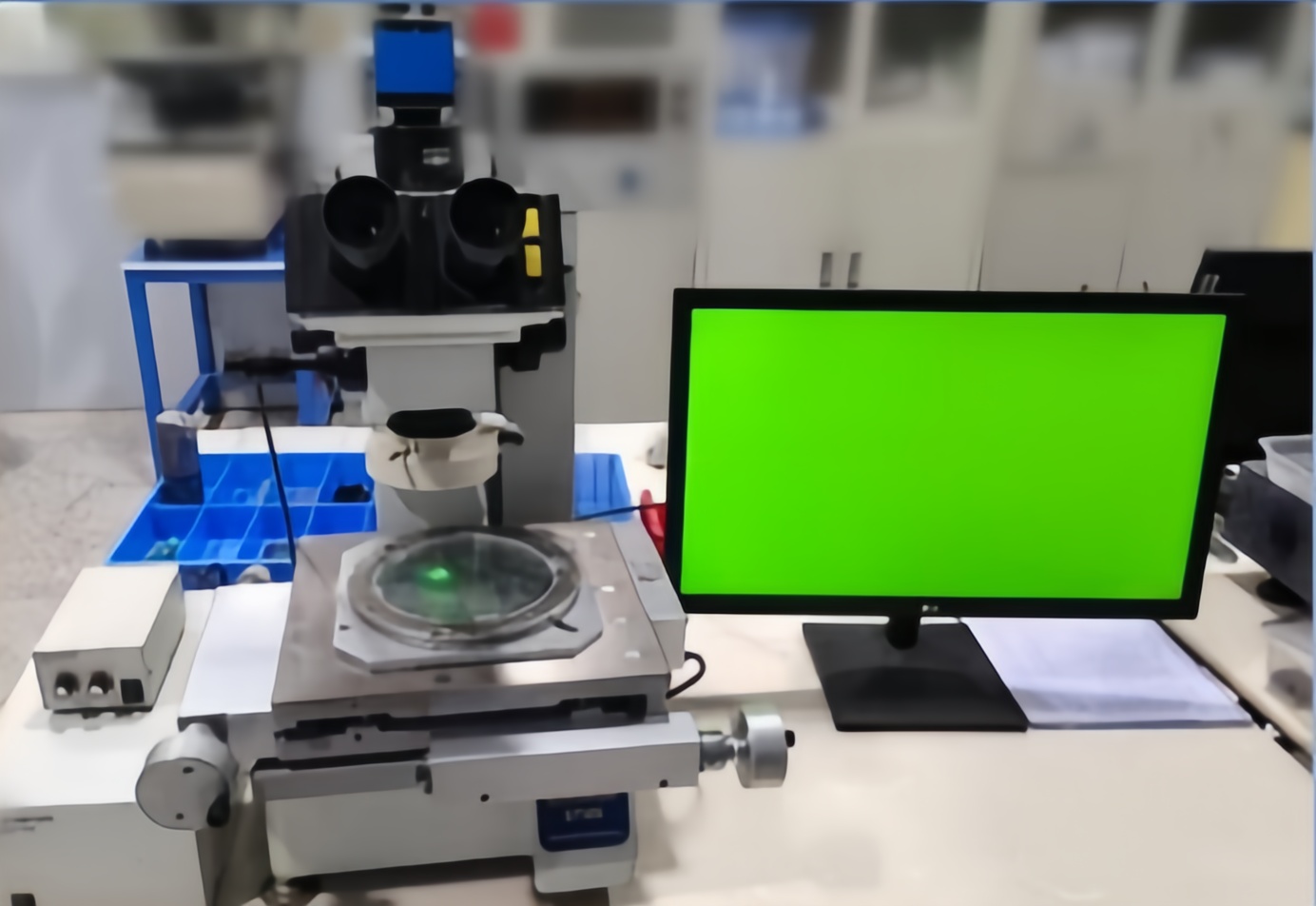 High-magnification Olympus toolmaker's microscope for precise inspection of complex micro-components