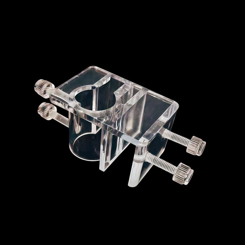 Clear acrylic aquarium hose clamp and pipe holder fixture with adjustable screws for attaching tubing to fish tank rim